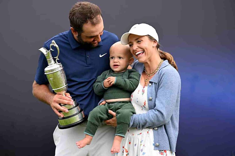 Scottie Scheffler of the United States celebrates victory on 18th green with his son Bennett Scheffler, wife Meredith Scheffler.