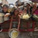Palestinians struggle to get donated food at a community kitchen in Gaza City, northern Gaza Strip, Aug. 16, 2025.