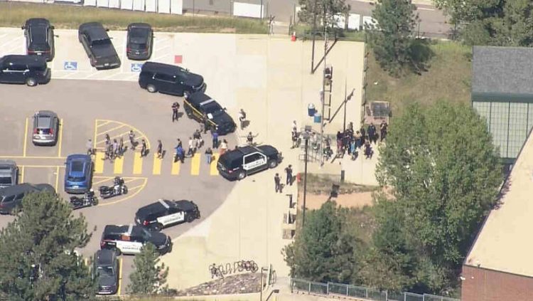 People can be seen filing out of Evergreen High School at 1:37 p.m. after a shooting there Wednesday afternoon, Sept. 10, 2025